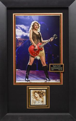 Features signed Fearless CD cover by Taylor Swift with photograph of Swift playing a Gibson Les Paul